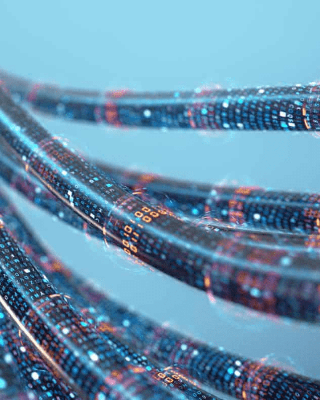 Trustack MSP Cyber Security, IT Services, IT Support. Close-up image of several data cables or fibers with illuminated binary code patterns (ones and zeroes) on them, resembling an ISDN network. The background is a soft blue gradient, giving the image a high-tech and futuristic feel.