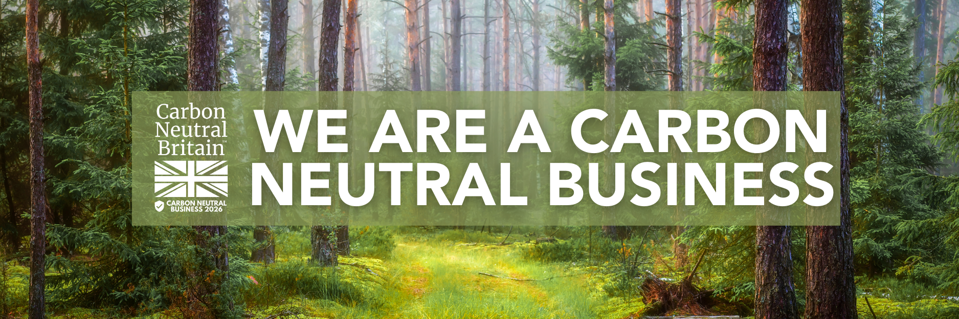 Trustack MSP Cyber Security, IT Services, IT Support. A lush forest with tall trees and green undergrowth. Text overlay reads: “Carbon Neutral Britain. Trustack – proudly a Carbon Neutral business for the consecutive year. Carbon Neutral Business 2024.”.